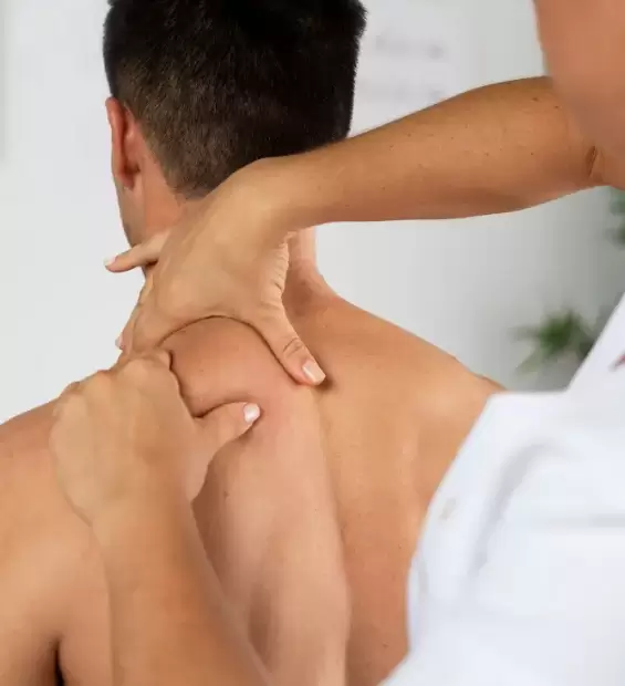 physiotherapist-performing-therapeutic-massage-male-client